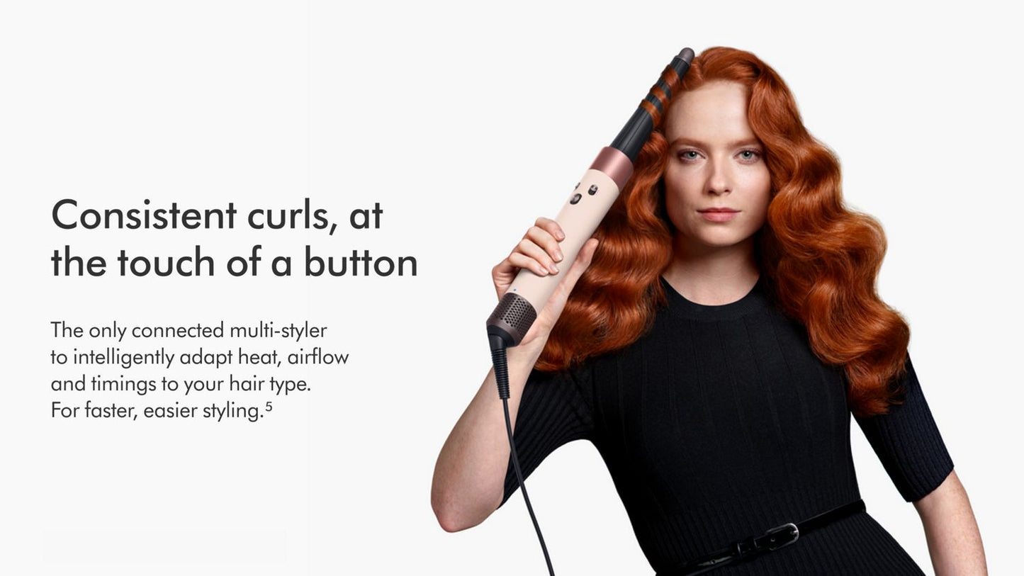 Woman curling hair with the Dyson Airwrap ID multi-styler.